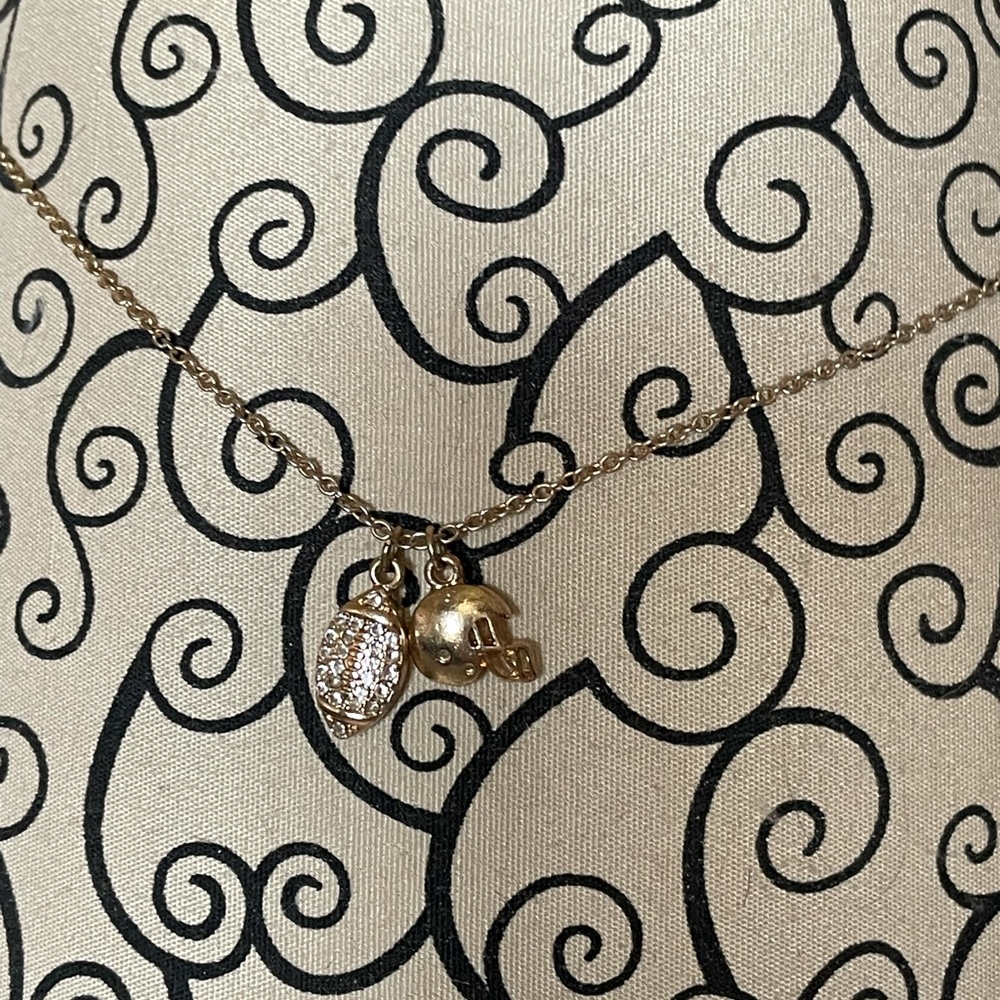 Charming Charlie gold football charms necklace